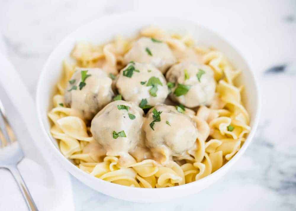 Moist and tender Swedish meatballs covered in a creamy gravy sauce. These flavorful meatballs make a delicious weeknight dinner that the whole family will love. Swedish meatball recipe.