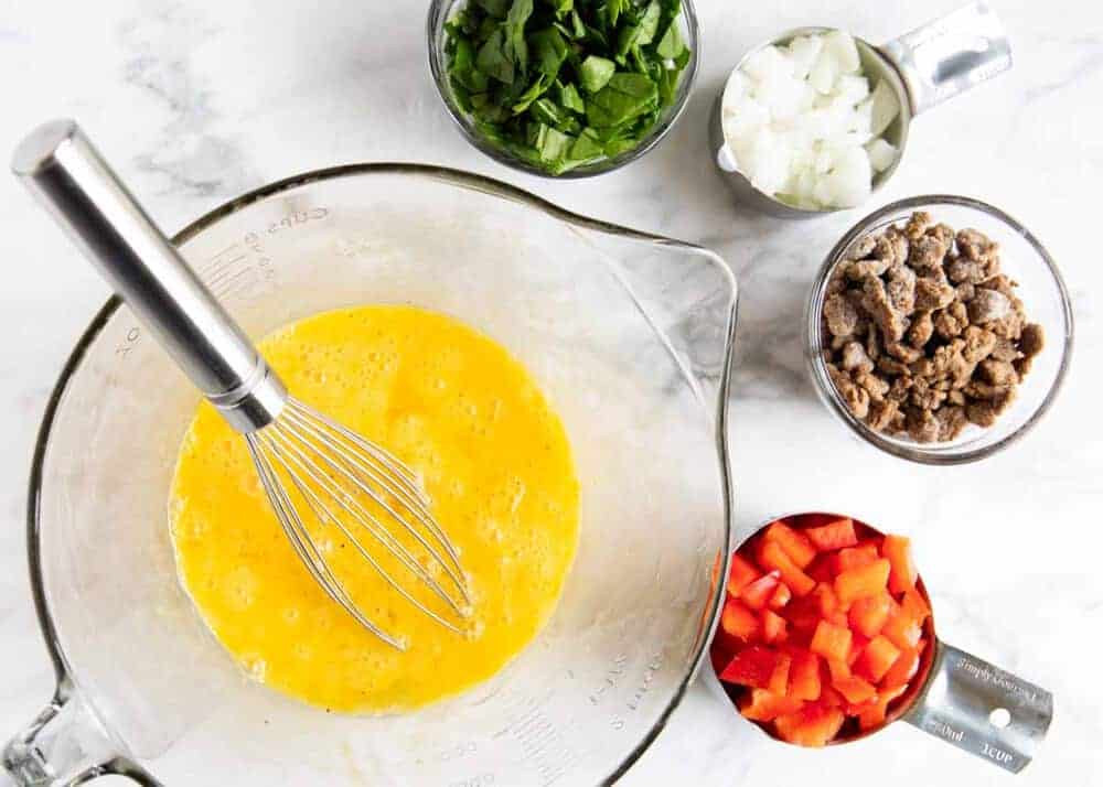 Frittata muffin ingredients in measuring cups.