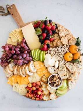 fruit and cheese platter on circle board